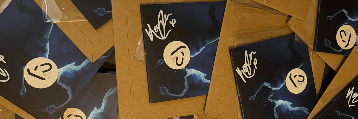 A stack of Kayla's 'Fractures' albums, signed and ready to be posted.